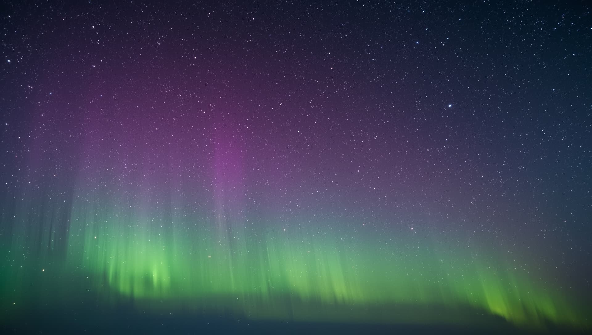 Aurora borealis over a dark horizon — the S.H.S Studio identity image
